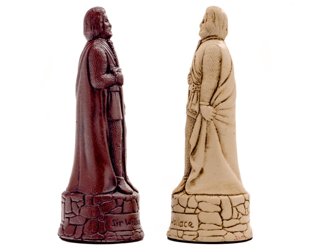 Intricately sculpted Scottish chess pieces in deep russet and cream, made of solid crushed stone resin, featuring historical designs.