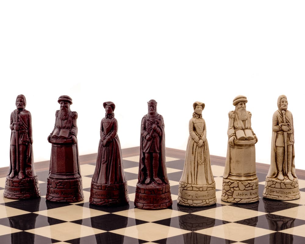 Berkeley Chess Scottish Russet Chess Men on chessboard with deep russet and cream pieces, intricately sculpted with historical designs