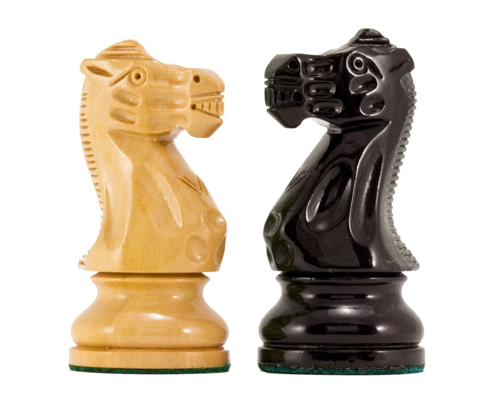 Atlantic Series Staunton chess knights in black and natural lacquered boxwood, showcasing highly polished finish and intricate design.