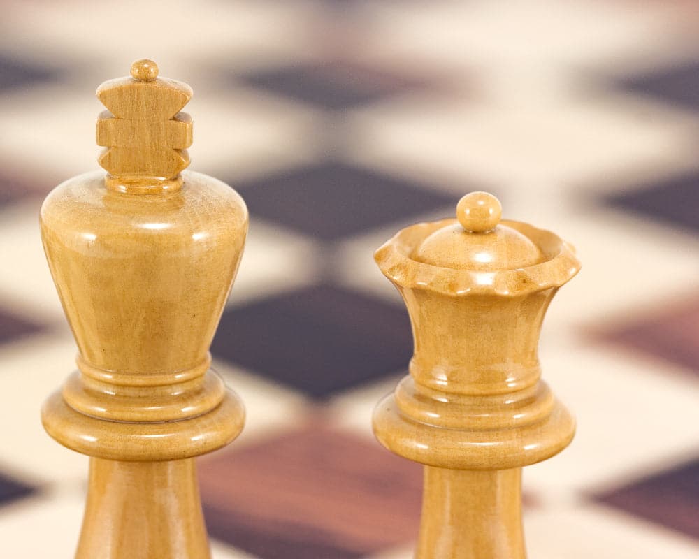 Atlantic Series Staunton boxwood chess king and queen on chessboard.