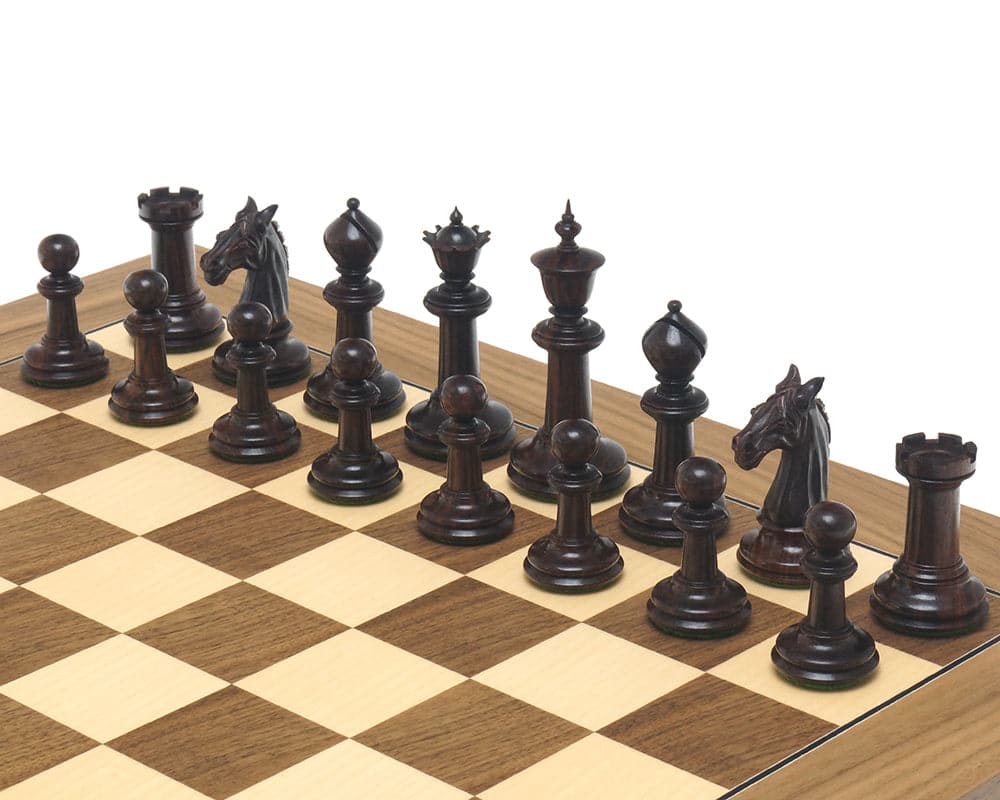The Bath Chessmen 3.75 Inch Rosewood set up on a wooden chessboard