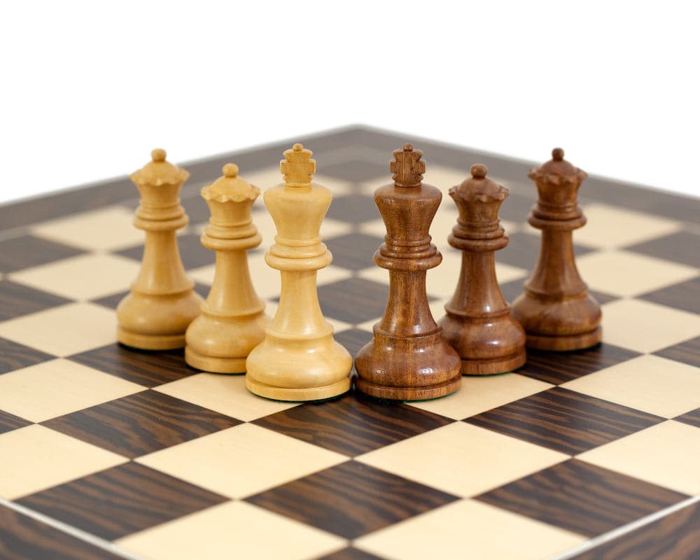 The Rochester Ebony Chessmen set on a 19 inch chess board with 1.9 inch squares, featuring beautifully crafted black and white pieces.