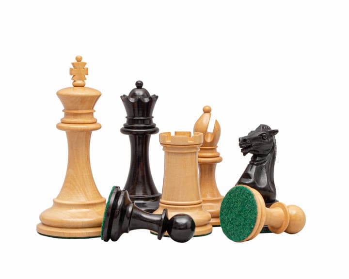 The Rochester Ebony Chessmen 4 inch set on display, featuring beautifully crafted chess pieces made in Spain, with high quality wood.