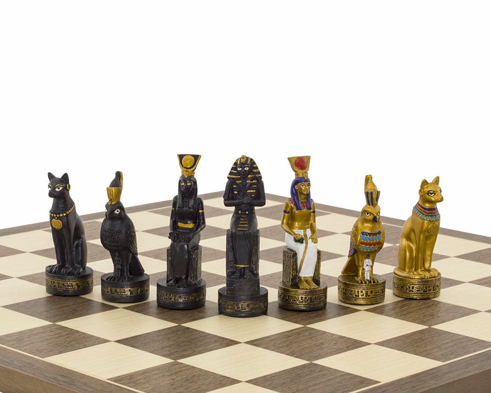 Hand painted Ancient Egypt themed chess pieces by Italfama on a walnut and maple board, including ornate gold and black figurines.