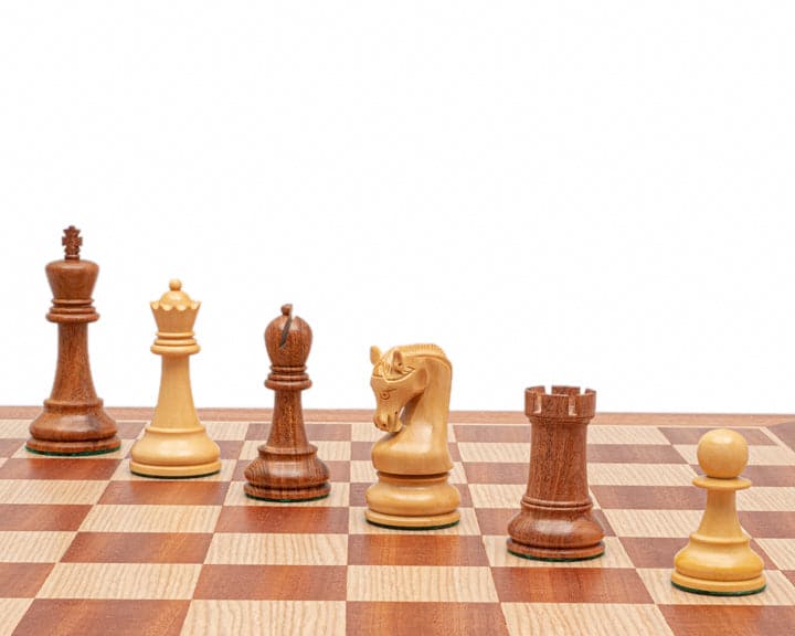 The Leningrad Acacia and Mahogany Chess Set on a chessboard with classic Staunton design and flawless finish.