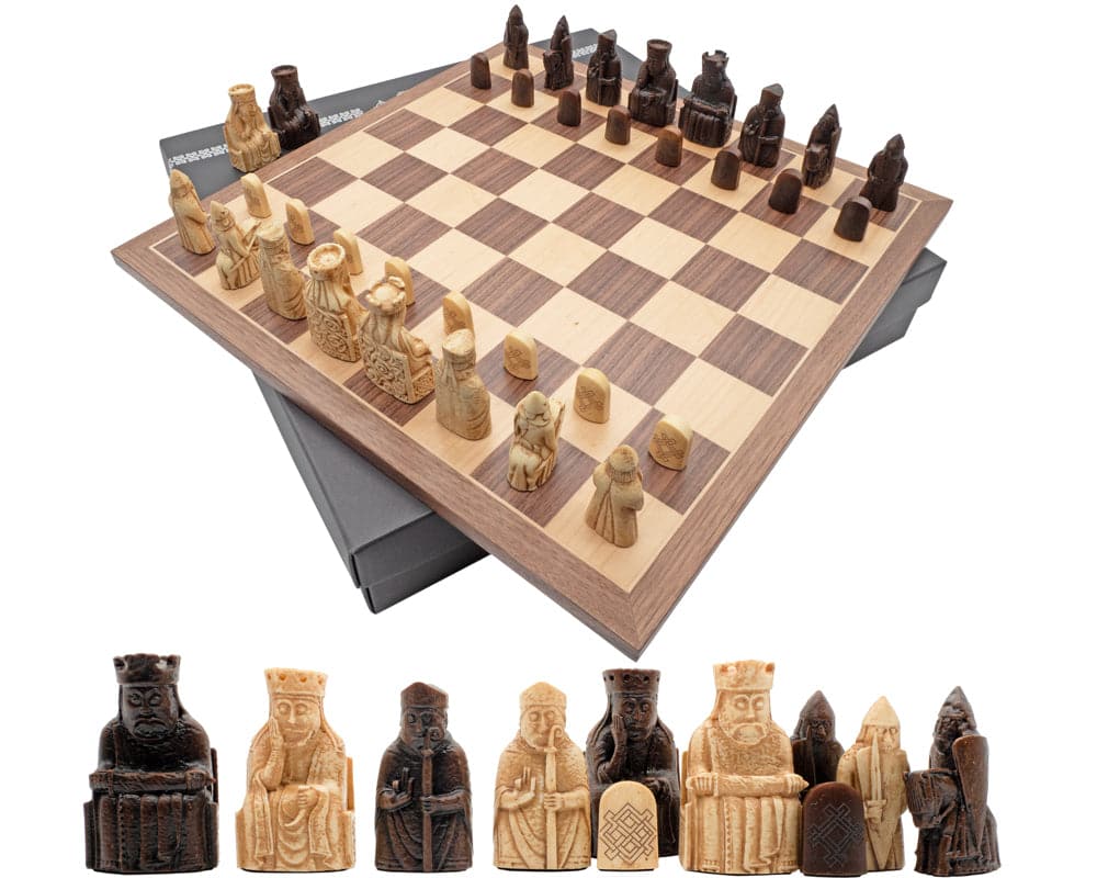 Isle of Lewis Chessmen and Board Presentation Set - Artisanal solid brass and nickel-plated chess pieces on a wooden chessboard.