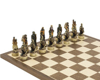 Zombie hand-painted themed chess pieces by Italfama on a chessboard. Exquisitely ornate, crafted in Italy, 3-inch king, felted bases.
