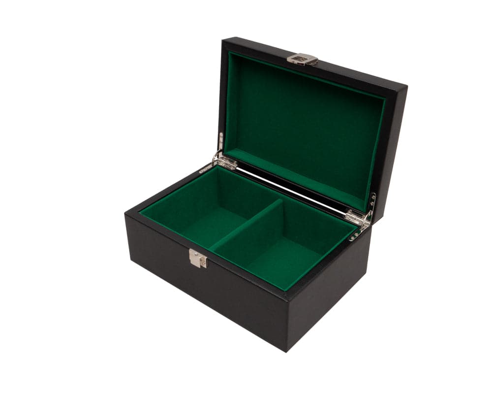 Black leatherette chess piece case with cushioned interior compartments and chrome accents open on white background