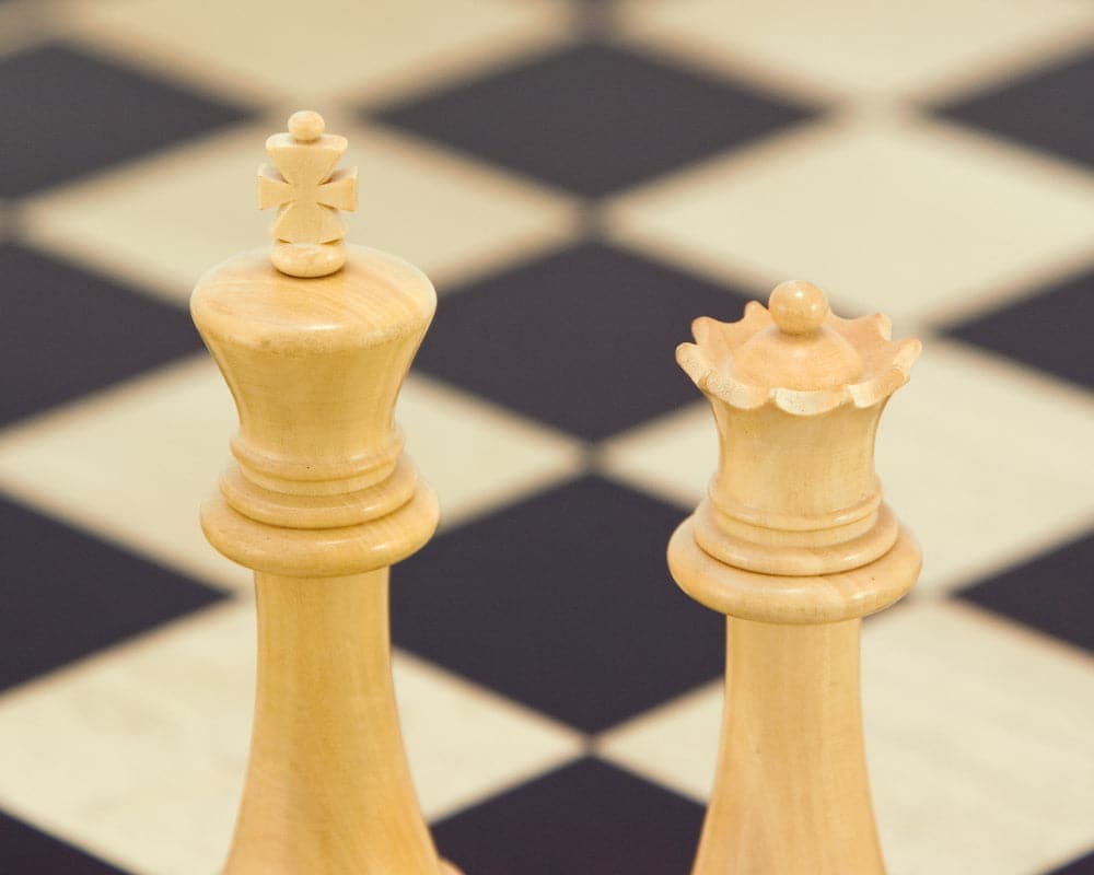 Victoria Series Ebonised Boxwood Chessmen on Chessboard - Close-up of King and Queen Pieces