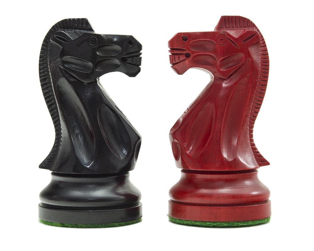 Red and black Staunton design chess knights from the Broadbase Chess Men set by The Regency Chess Company