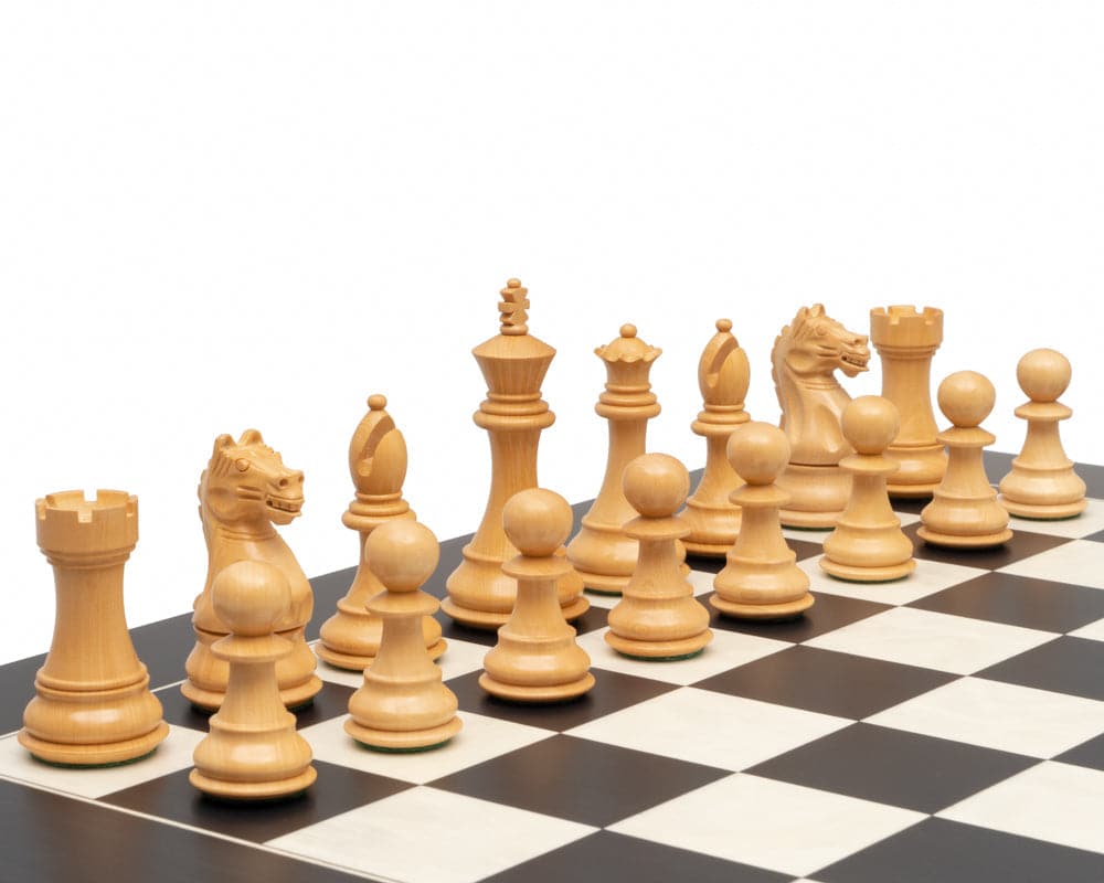 Natural wooden chessmen set up on a black and white chessboard, featuring carved pieces including pawns, knights, rooks, bishops, queen, and king.