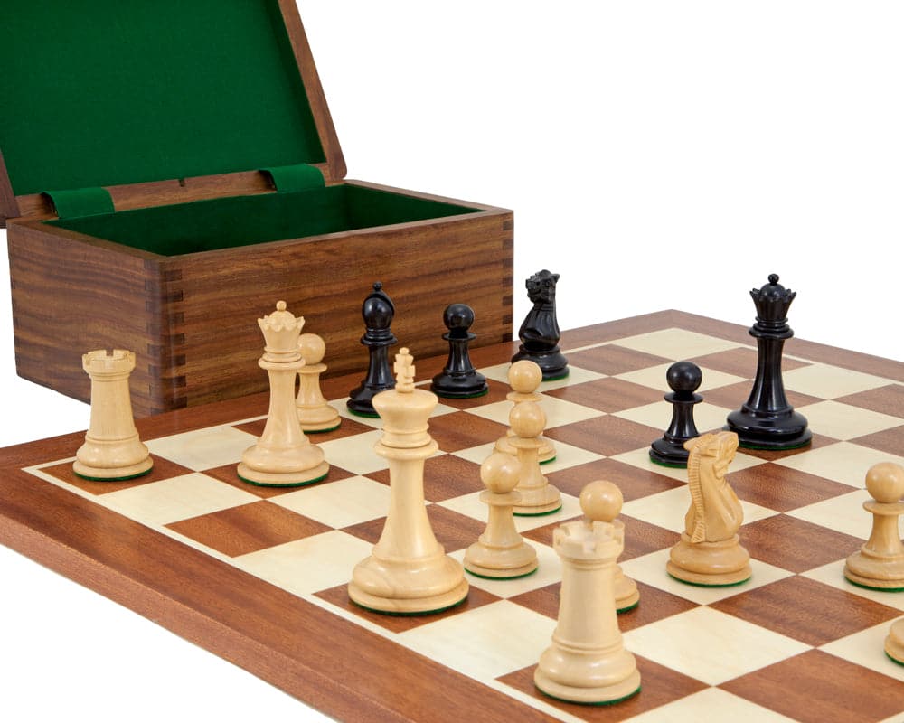 Old English Elite Ebony Mahogany Chess Set on board with weighted and felted Staunton pieces, solid golden rosewood case in background.