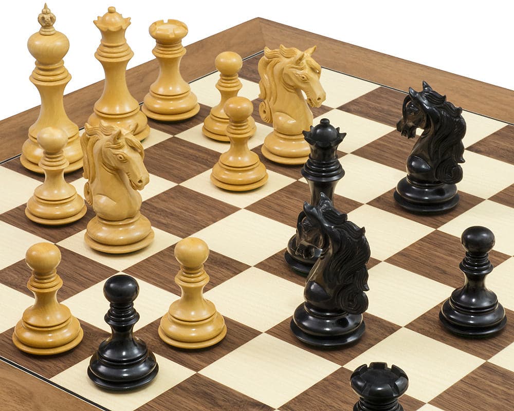 The Cavalry Ebony & Walnut Luxury Chess Set with beautifully crafted weighted knight pieces on a walnut and maple board.