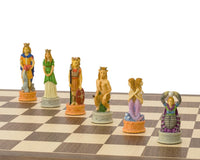 Hand-painted Zodiac chess pieces on a wooden chessboard, featuring detailed Leo and Aquarius kings, made by Italfama.
