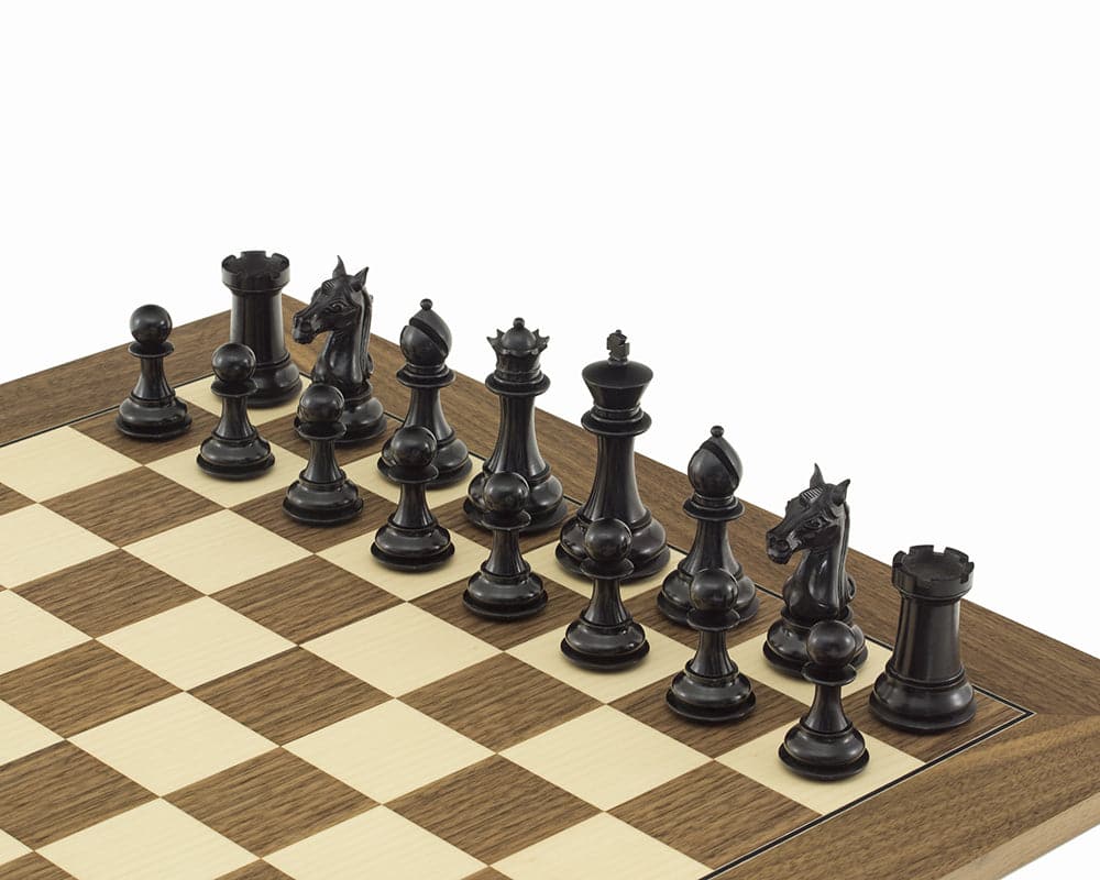 The Columbus Ebony and Walnut chess set on a walnut and maple board with ornate Staunton design pieces and a 4-inch King.