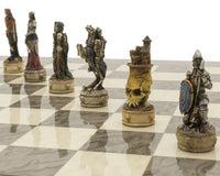 Hand-painted resin zombie chess pieces on a glossy grey ash burl board