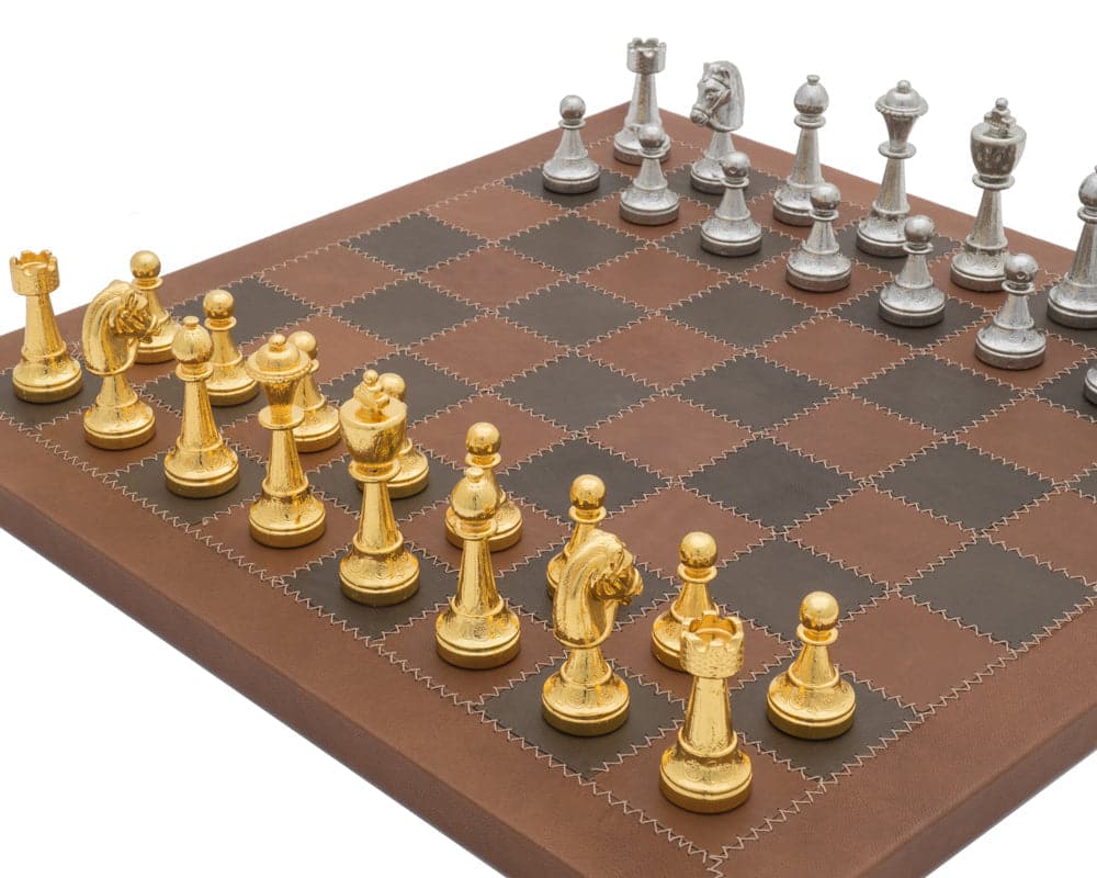 The Messina Gold and Silver Italian Leather Luxury Chess Set featuring elegant gold and silver chess pieces on a leather chessboard.
