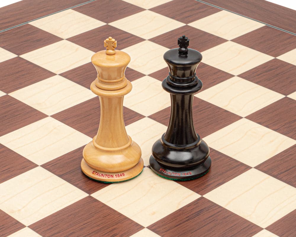 The 1849 Original Staunton Ebony and Palisander luxury chess set kings on a beautifully crafted chess board.