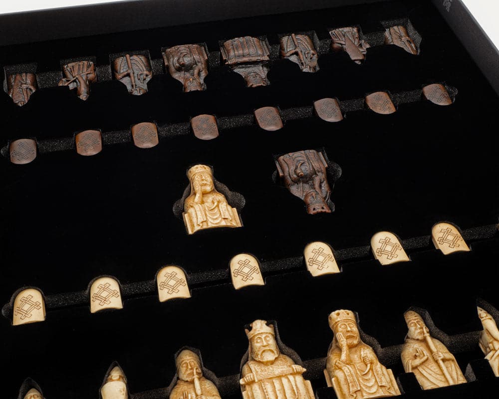 Isle of Lewis Chessmen and Board Presentation Set featuring detailed, artisanal chess pieces crafted by Italian craftsmen, including a 3-inch king.