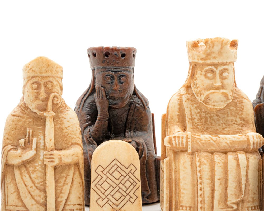 Close-up of Isle of Lewis Chessmen, finely crafted and detailed chess pieces, showcasing artisanal craftsmanship in a classic design.